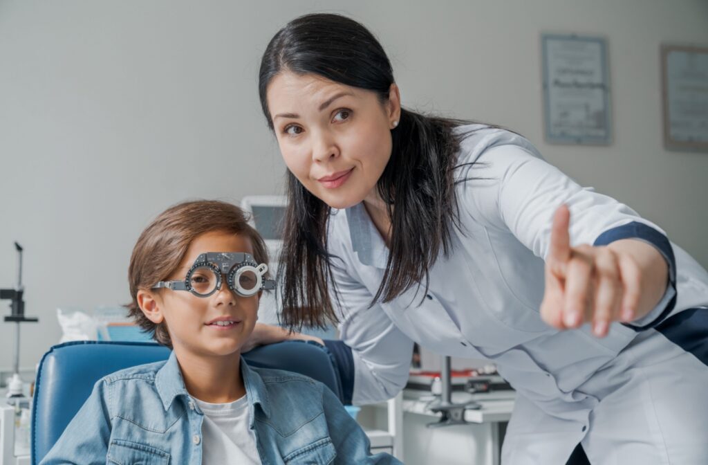 A child and the eye doctor having their eyes assessed for signs of myopia and if myopia therapy is needed.